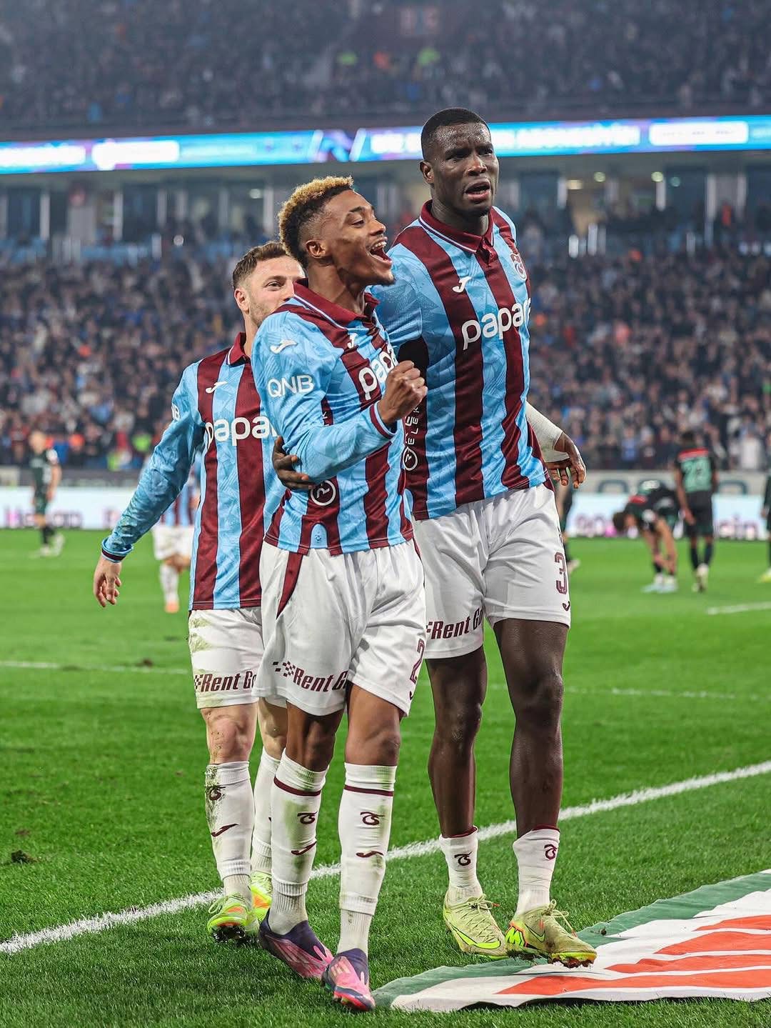Onuachu celebrating with teammates after scoring his second goal of the game 
